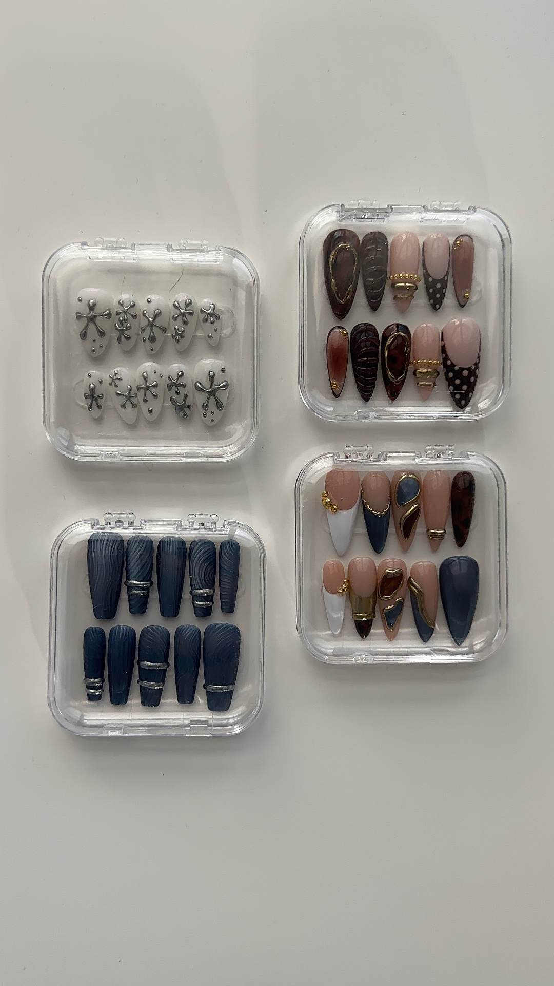 Beautifully manicured nails with delicate gold jewellery