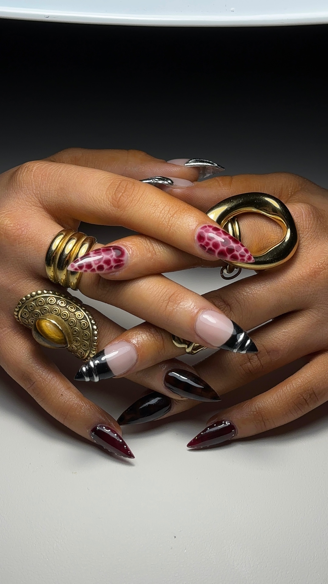 Editorial snake print stiletto nails with gold rings