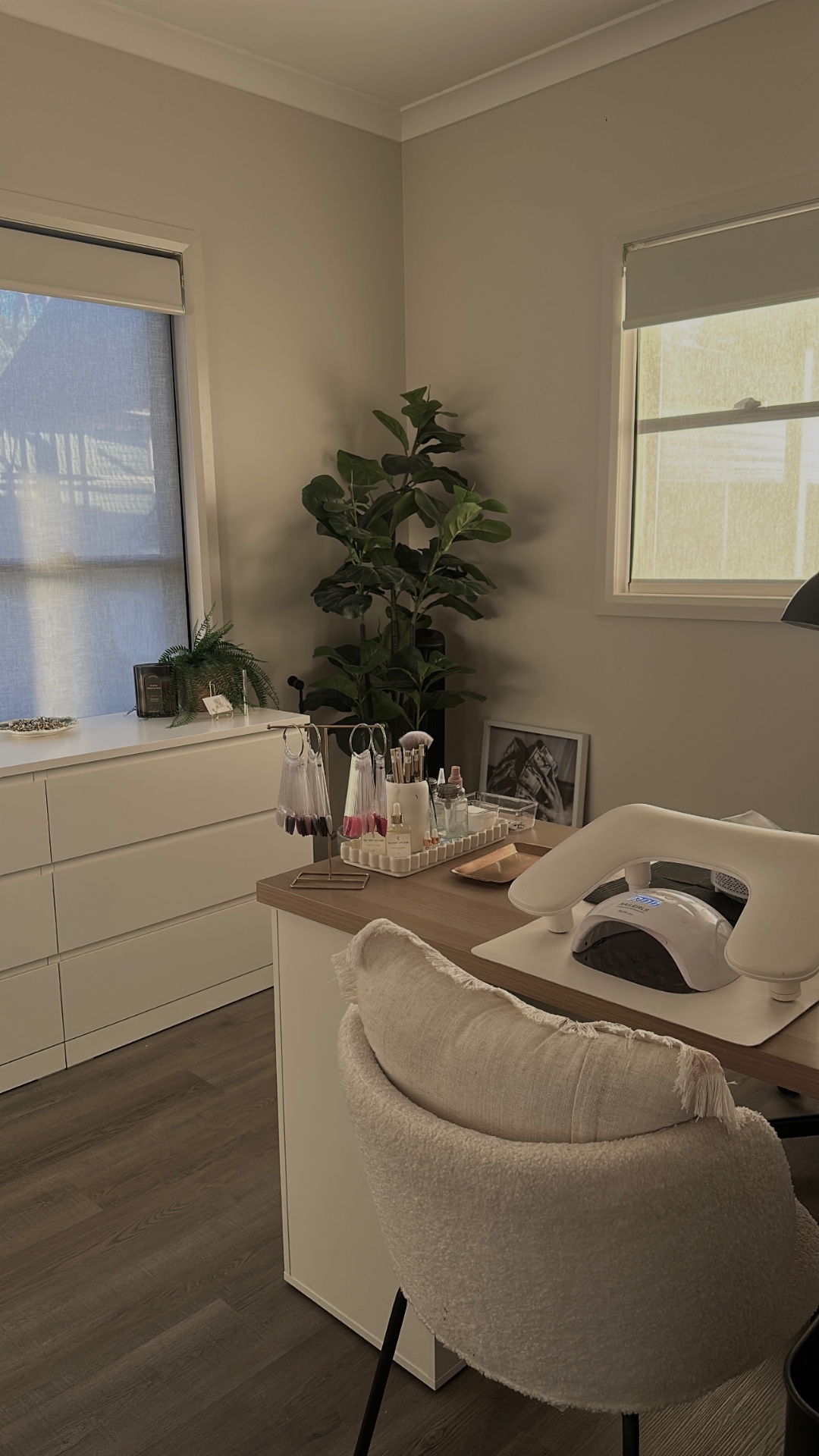 The suite in soft daylight — polish rack, brushes and boucle chair by the window